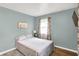 This bedroom boasts hardwood floors, a window and closet at 621 S Jefferson St, Brownsburg, IN 46112
