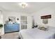 Bedroom features a bed with colorful pillows and a large blue dresser at 621 S Jefferson St, Brownsburg, IN 46112