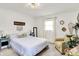Bright bedroom features white walls, comfortable carpet, and bright natural light at 621 S Jefferson St, Brownsburg, IN 46112