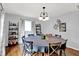 Dining room features natural light, hardwood floors, and decorative shelving at 621 S Jefferson St, Brownsburg, IN 46112