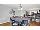Dining room features a round dining table and decorative artwork at 621 S Jefferson St, Brownsburg, IN 46112