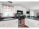 Well-equipped kitchen with modern appliances, island, and easy access to dining area at 621 S Jefferson St, Brownsburg, IN 46112