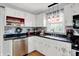 Stylish kitchen with granite countertops, stainless steel appliances, and subway tile backsplash at 621 S Jefferson St, Brownsburg, IN 46112