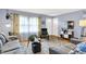 Inviting living room showcasing neutral colors, wood floors, and comfortable seating with plentiful natural light at 621 S Jefferson St, Brownsburg, IN 46112