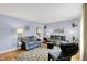 Comfortable living room with neutral-toned walls, wood floors, and cozy seating arrangements at 621 S Jefferson St, Brownsburg, IN 46112