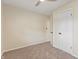 Bright bedroom featuring neutral carpet, light walls and a white door at 6609 Cordova Ct, Indianapolis, IN 46221