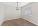 Bright room with updated flooring, modern light fixture, and natural light at 6609 Cordova Ct, Indianapolis, IN 46221