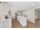 Bright and modern kitchen with a large island, sleek cabinetry, and stainless steel appliances at 6609 Cordova Ct, Indianapolis, IN 46221