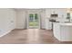 Bright kitchen features white cabinetry, stainless steel appliances, and access to the backyard at 6609 Cordova Ct, Indianapolis, IN 46221
