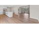 Open concept kitchen with a large island, white cabinets, and stainless steel appliances at 6609 Cordova Ct, Indianapolis, IN 46221