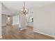 Open-concept living space showcasing modern lighting and easy access to the updated kitchen at 6609 Cordova Ct, Indianapolis, IN 46221