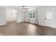 Open living area with updated floors and natural light from the large window at 6609 Cordova Ct, Indianapolis, IN 46221
