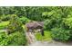 Aerial view of the property showcasing the house, mature trees, and surrounding landscape at 6655 Teeters Ln, Martinsville, IN 46151