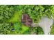 Overhead aerial view of the property with lush greenery and mature trees, roof and wooden deck at 6655 Teeters Ln, Martinsville, IN 46151