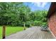 Back deck of house featuring wood flooring, wooden posts and view of backyard at 6655 Teeters Ln, Martinsville, IN 46151