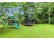 Backyard featuring a playset, trampoline, shed, and grass area at 6655 Teeters Ln, Martinsville, IN 46151