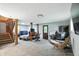 Finished basement features flexible space with fireplace, desk, bed, and exterior door at 6655 Teeters Ln, Martinsville, IN 46151