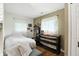 This cozy bedroom features two windows providing natural light and a custom built desk with shelving at 6655 Teeters Ln, Martinsville, IN 46151
