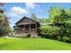 Charming home with a cozy covered front porch and well-maintained lawn at 6655 Teeters Ln, Martinsville, IN 46151
