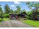 Charming front exterior view of the home with covered porch and mature trees at 6655 Teeters Ln, Martinsville, IN 46151