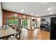 Wide angle view of the kitchen with stainless steel appliances and views into the dining space at 6655 Teeters Ln, Martinsville, IN 46151