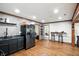 A modern kitchen features stainless steel appliances, dark cabinets and subway tile backsplash at 6655 Teeters Ln, Martinsville, IN 46151