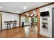 Wide angle view of the open living area with hardwood floors and views into the dining space at 6655 Teeters Ln, Martinsville, IN 46151