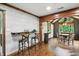 Wide angle view of the open living area with hardwood floors and views into the dining space at 6655 Teeters Ln, Martinsville, IN 46151