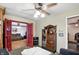 The view from the office looks into a cozy living room with hardwood floors and a comfortable seating area at 6655 Teeters Ln, Martinsville, IN 46151