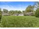 Fenced backyard with plenty of green space and a shed at 7125 Chandler Dr, Indianapolis, IN 46217