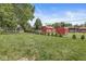 Large backyard with shed, greenery, and fence at 7125 Chandler Dr, Indianapolis, IN 46217