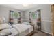This bedroom is decorated with colored curtains and neutral gray paint at 7125 Chandler Dr, Indianapolis, IN 46217