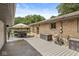 Back deck with seating and views of the home's exterior at 7125 Chandler Dr, Indianapolis, IN 46217