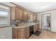 Efficient kitchen featuring wood cabinets, mosaic backsplash, and modern appliances for easy meal preparation at 7125 Chandler Dr, Indianapolis, IN 46217