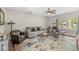 Inviting living room featuring a comfortable sofa, leather chairs, and a patterned rug for added style at 7125 Chandler Dr, Indianapolis, IN 46217