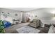 Neutral living room with an adjacent room, chair and gray carpet at 7125 Chandler Dr, Indianapolis, IN 46217