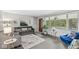 Bright living room with neutral paint, large windows, and stylish decor at 7125 Chandler Dr, Indianapolis, IN 46217
