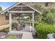 Exterior view of the backyard patio with outdoor furniture at 7125 Chandler Dr, Indianapolis, IN 46217