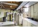 Utility room with water heaters, washer and dryer, and room for extra storage, with concrete floors at 7165 W State Road 252 W Rd, Edinburgh, IN 46124