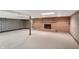 Spacious basement area with fireplace and wood paneling, offering room for recreation or storage at 7165 W State Road 252 W Rd, Edinburgh, IN 46124