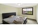 This bedroom features a large window with an expansive view and neutral color walls at 7165 W State Road 252 W Rd, Edinburgh, IN 46124