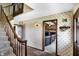Entryway and staircase showcases brick flooring and an entrance to the living room at 7165 W State Road 252 W Rd, Edinburgh, IN 46124