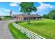 The home's exterior features a well-maintained yard, three-car garage, and lovely landscaping, creating an inviting appeal at 7165 W State Road 252 W Rd, Edinburgh, IN 46124