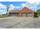 A spacious three-car garage offers ample parking and storage space, complementing the home's exterior at 7165 W State Road 252 W Rd, Edinburgh, IN 46124