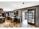 Kitchen boasts wood cabinets, neutral countertops, stainless steel appliances, and access to the sunroom at 7165 W State Road 252 W Rd, Edinburgh, IN 46124