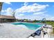 An outdoor pool with a diving board and slide sits in a weathered enclosure, ready for revitalization and summer fun at 7165 W State Road 252 W Rd, Edinburgh, IN 46124