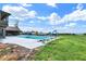 An outdoor pool with a slide nestled beside lush green grass, offering a perfect spot for summer relaxation at 7165 W State Road 252 W Rd, Edinburgh, IN 46124