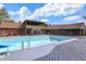 Back exterior view of home with outdoor pool and wooden deck under partly cloudy skies at 7165 W State Road 252 W Rd, Edinburgh, IN 46124
