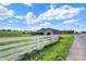 A charming property featuring a white picket fence and ample green space, perfect for enjoying the outdoors at 7165 W State Road 252 W Rd, Edinburgh, IN 46124