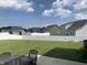Expansive backyard with lush green lawn and white fencing, perfect for outdoor activities and privacy at 7270 W Stone Pass, New Palestine, IN 46163